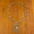 Beaded floral necklace, 'Crystal Bloom' - Hand Crocheted Stainless Steel Necklace with Crystal Beads