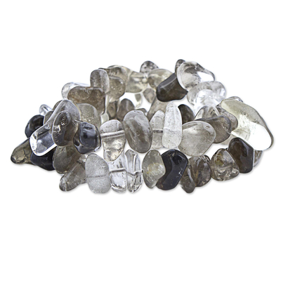 Smoky quartz and crystal stretch bracelets, 'Translucent Crystal' (pair) - Smoky and Clear Quartz Stretch Bracelets (Pair) from Brazil