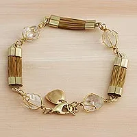 Pulsera con pieza de cuarzo rosa rectangular de plata bañada en oro y  cordón beige.