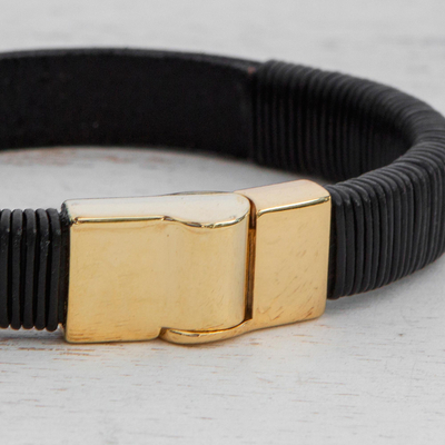 Leather wristband bracelet, 'Fearless Strength' - Black Leather Wristband Bracelet Gold-Toned Steel Clasp