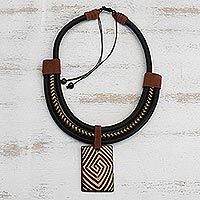 Suede accented ceramic pendant necklace, 'Tribal Spiral'