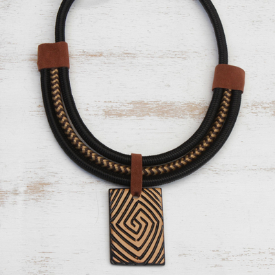 Suede accented ceramic pendant necklace, 'Tribal Spiral' - Spiral Pattern Suede Accent Ceramic Pendant Necklace
