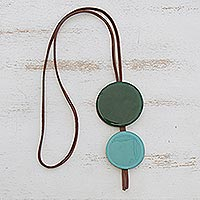 Glass and leather pendant necklace, 'Green Eclipse' - Green Glass and Leather Pendant Necklace from Brazil