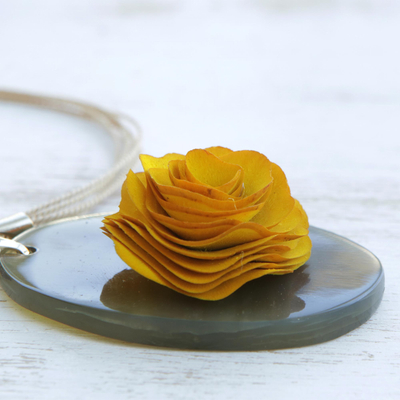 Wood and horn pendant necklace, 'Moody Rose' - Oval Wood and Horn Flower Pendant Necklace from Brazil