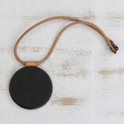 Fused glass pendant necklace, 'Mysterious Midnight' - Black Fused Glass Disc Pendant Brown Leather Cord Necklace
