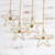 Golden grass ornaments, 'Golden Stars' (set of 4) - Golden Grass and Rhinestone Star Ornaments (Set of 4)