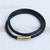 Leather cord wrap bracelet, 'Black and Gold Urban Confidence' - Brazilian Black & Golden Leather Cord Wrap Bracelet