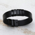 Leather wristband bracelet, 'Black Planets, Black Universe' - Modern Black Leather Wristband Bracelet from Brazil