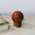 Calcite sculpture, 'Warm Energy' - Little Orange Calcite Ball Sculpture with Cedar Wood Stand
