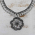 Crocheted soda pop-top pendant necklace, 'Eco Flower in Grey' - Floral Grey Crocheted Soda Pop-Top Pendant Necklace