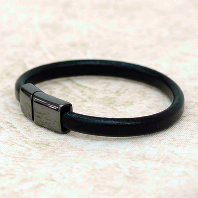 Leather wristband bracelet, 'Black Cosmopolitan' - Unisex Black Leather Wristband Bracelet with Zamac Clasp