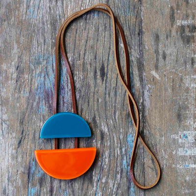 Recycled fused glass and leather pendant necklace, 'Crescent in Teal and Orange' - Recycled Fused Glass and Leather Crescent Pendant Necklace
