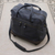 Expandable leather wheeled travel bag, 'Style Voyager' - Black and Navy Expandable Leather Travel Bag with Wheels