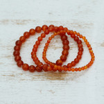 Carnelian beaded stretch bracelets, 'My Courageous Sides' (set of 3) - Set of Three Handcrafted Carnelian Beaded Stretch Bracelets