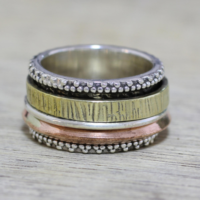 Sterling silver meditation spinner ring, 'Textured Beauty' - Sterling Silver Copper and Brass Textured Spinner Ring