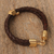Gold-accented braided leather pendant bracelet, 'Death and Life' - Mexican Double Strand Braided Leather Bracelet in Brown