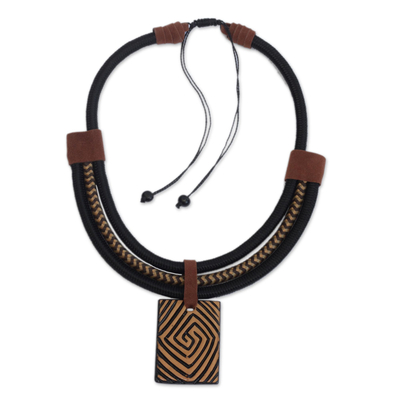 Suede accent ceramic pendant necklace, 'Tribal Spiral' - Spiral Pattern Suede Accent Ceramic Pendant Necklace