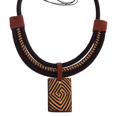 Suede accent ceramic pendant necklace, 'Tribal Spiral' - Spiral Pattern Suede Accent Ceramic Pendant Necklace