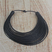 Leather statement necklace, 'Bayala' - Handmade Black Leather Strand Statement Necklace from Ghana