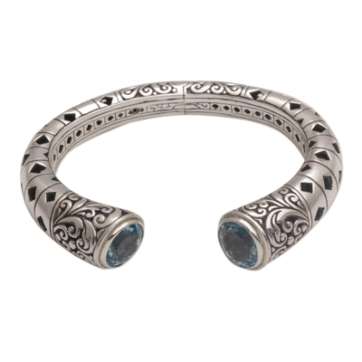 Blue topaz cuff bracelet, 'Borobudur Dew' - Blue Topaz and Sterling Silver Borobudur Motif Cuff Bracelet