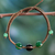 Onyx Shambhala-style bracelet, 'Protective Tranquility' - Green and Black Onyx Hand-braided Shambhala-style Bracelet