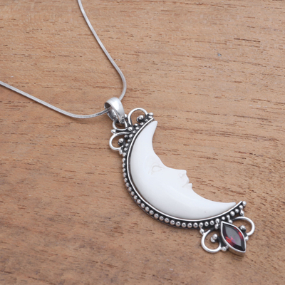 Garnet and bone pendant necklace, 'Crescent Moon' - Garnet and Bone Crescent Moon Pendant Necklace from Bali