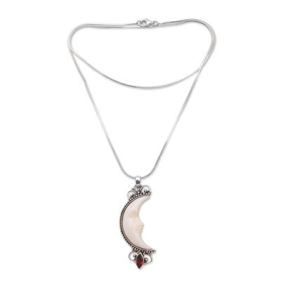 Garnet and bone pendant necklace, 'Crescent Moon' - Garnet and Bone Crescent Moon Pendant Necklace from Bali