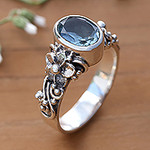 Oval Cut Blue Topaz and Silver Ring with Floral Design, 'Frangipani Path'
