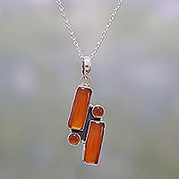 Carnelian pendant necklace, 'Radiant Allure' - Carnelian and Sterling Silver Pendant Necklace from India