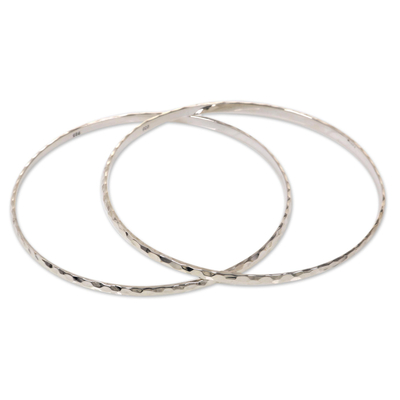 Sterling silver bangle bracelets, 'Sterling Circles' (pair) - Women's Bangle Bracelets from Bali in Sterling Silver (Pair)