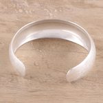 Sterling silver cuff bracelet, 'Glimmering Charm' - Brushed-Satin Sterling Silver Cuff Bracelet from India