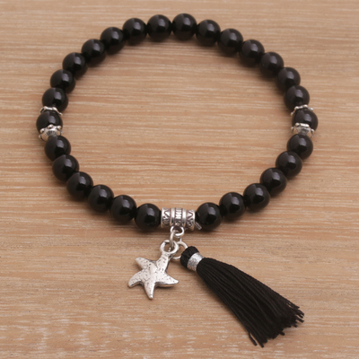 Onyx beaded stretch charm bracelet, 'Deep Sea Star' - Onyx Beaded Stretch Bracelet with Sterling Silver Starfish