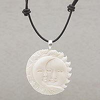 Bone pendant necklace, 'Stellar Guardians' - Handcrafted Sun and Moon Bone Pendant Necklace from Bali