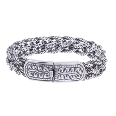 Sterling silver braided bracelet, 'Symmetry' (7.25 inch) - Fair Trade Sterling Silver Wristband Bracelet (7.25 Inch)