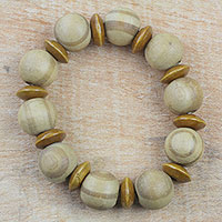 Wood beaded stretch bracelet, 'Natural Circles' - Light Brown Sese Wood Beaded Stretch Bracelet from Ghana