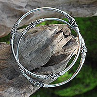 Sterling silver bangle bracelets, 'Kintamani Moon' (pair) - Artisan Crafted Sterling Silver Bangles (Pair)