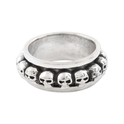 Sterling silver spinner ring, 'Skull Row' - Skull Pattern Sterling Silver Spinner Ring from Bali