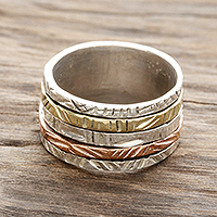 Sterling silver spinner ring, 'Moving Patterns' - Patterned Sterling Silver Spinner Ring with Brass and Copper