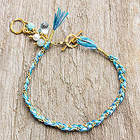 Gold plated multi-gemstone braided bracelet, 'Blue is for Peace' - Blue Theme Gold Plated Cotton Bracelet and Multi Gem Charms