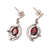 Rhodium plated garnet dangle earrings, 'Fascinating Swoop' - Curve Pattern Rhodium Plated Garnet Dangle Earrings