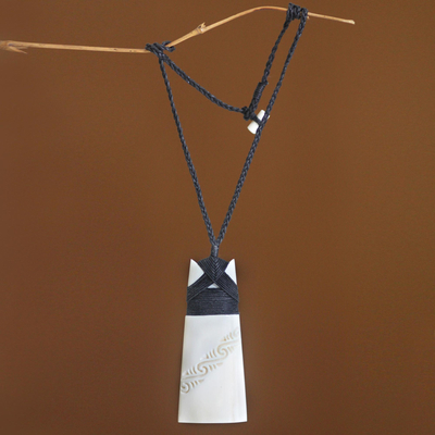 Pendant necklace, 'Peace and Stillness' - Hand Carved Bone Pendant Necklace with Black Cords