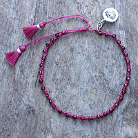 Garnet beaded macrame bracelet, 'Lovely Lotus' - Hand-knotted Garnet Beaded Bracelet with Silver charm