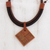 Suede accented ceramic pendant necklace, 'Square Labyrinth' - Suede Accent Square Ceramic Pendant Necklace from Brazil thumbail