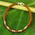 Silver accent wristband bracelet, 'Beautiful Jungle in Rust' - Handmade Wristband Braided Bracelet from Thai Artisan