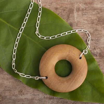 Wood pendant necklace, 'Nature Circle' - Pumaquiro Wood and 925 Sterling Silver Pendant Necklace