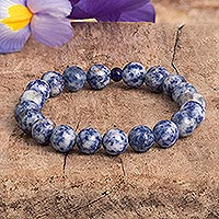 Carnelian and ceramic stretch bracelet, 'Peruvian Skies' - Blue and White Sodalite Beaded Stretch Bracelet from Peru