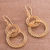 Gold plated filigree dangle earrings, 'Looped in Gold' - Gold-Plated Sterling Silver Filigree Circles Dangle Earrings