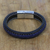 Leather wristband bracelet, 'Worldly Spirit in Blue' - Blue Braided Leather Wristband Bracelet from Thailand