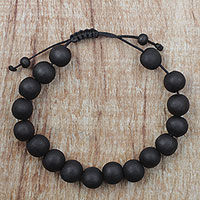 Ebony wood beaded bracelet, 'Chic Silhouettes' - Adjustable Ebony Wood Beaded Bracelet from Ghana