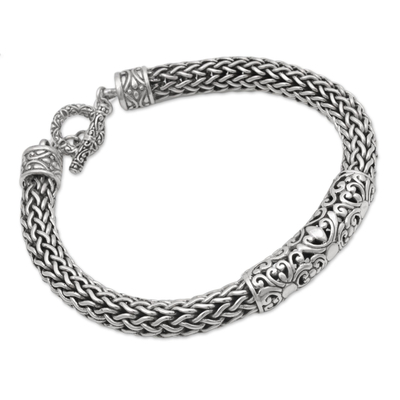 Sterling silver braided bracelet, 'Floral Dragon' - Artisan Braided Sterling Silver Floral Pendant Bracelet